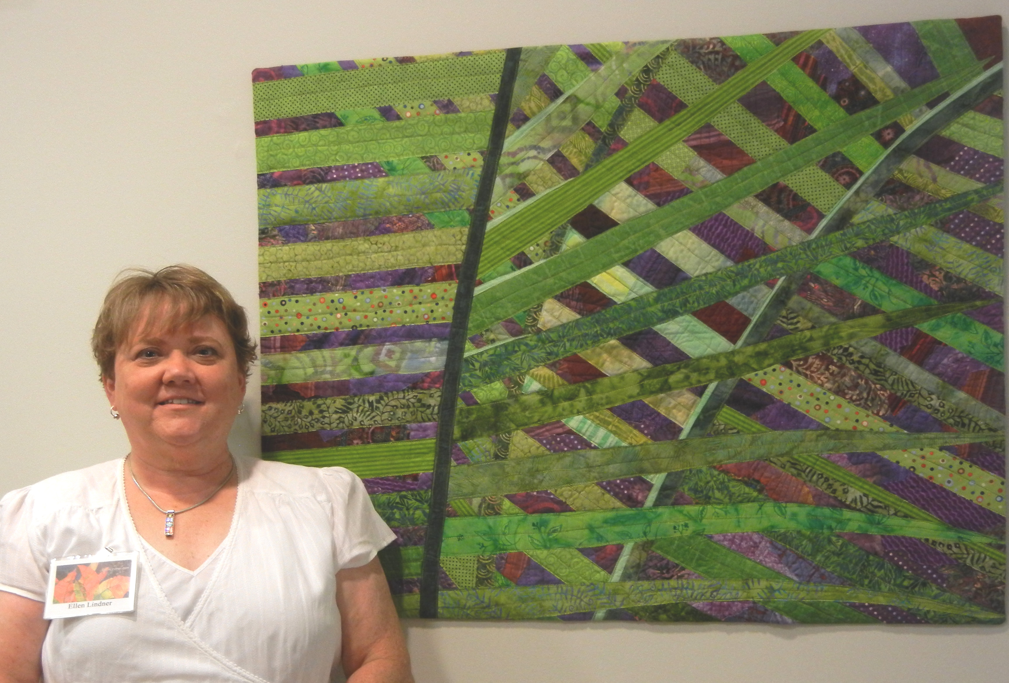 Ellen Lindner with her art quilt Crisscross.  AdventureQuilter.com