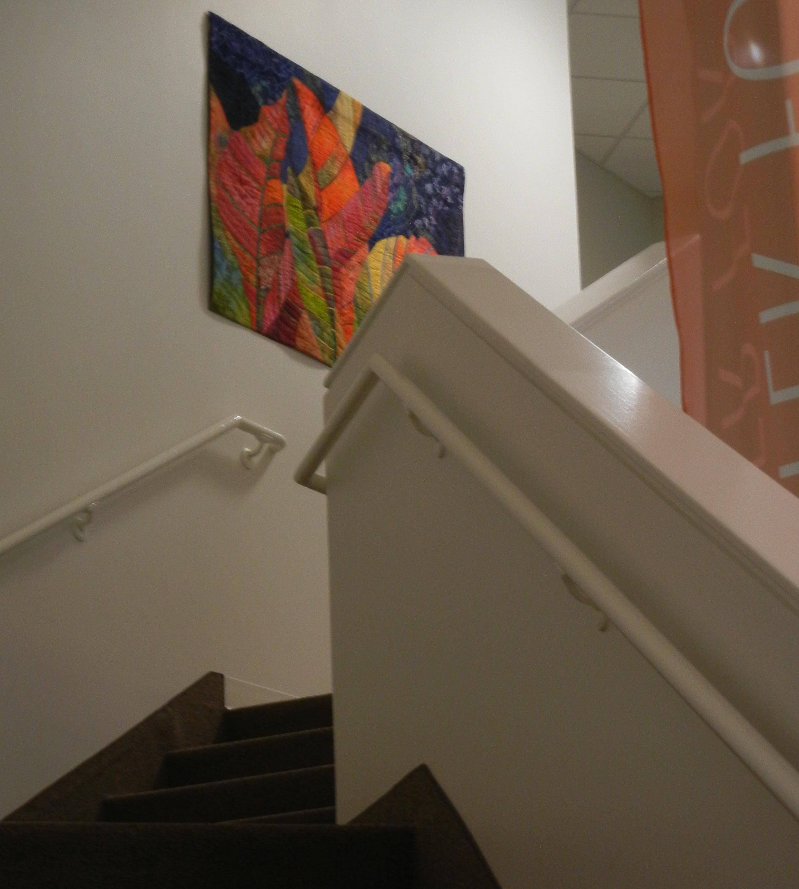 Ellen Lindner's Crotons, hung at the top of the stairs.  AdevntureQuilter.com