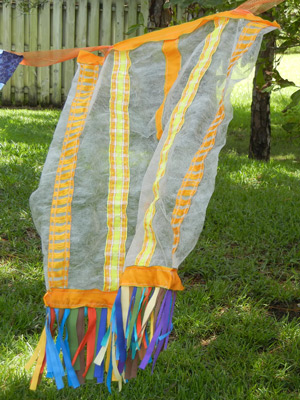 Image - yellow sheer fabric waving in the breeze