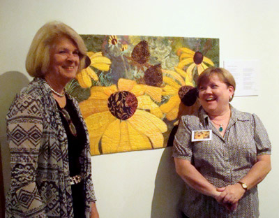 Image - 2 women in front of fabric collage