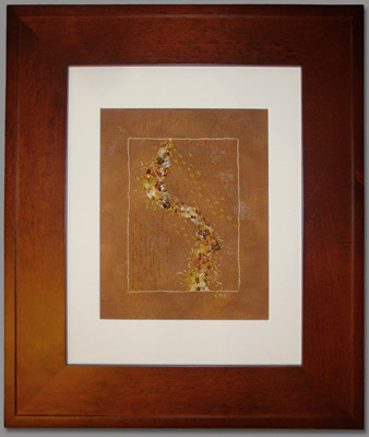 Image - hand stitching on rust fabric, matted and framed