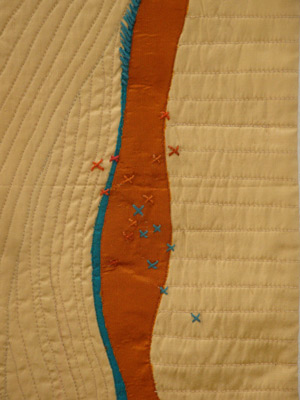 Image - tan background, rust line, hand stitching