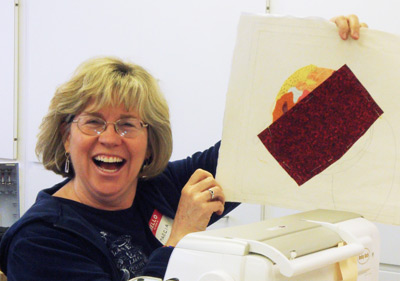 Marcia having fun in a Double Reverse Applique class, taught by Ellen Lindner, AdventureQuilter.com