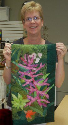 A happy student in Ellen Lindner's "Design Your Own Nature Quilt" class.  AdventureQuilter.com