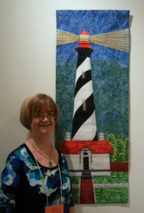 Kay Smith with her art at the Southern Accents exhibit.   AdventureQuilter.com/blog
