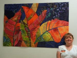 Ellen Lindner with her art at the Southern Accents exhibit.   AdventureQuilter.com/blog