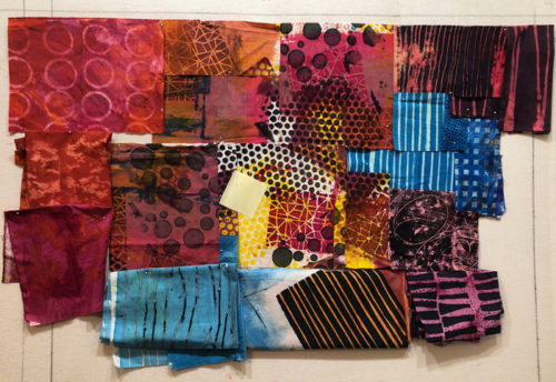 Ellen Lindner's design process: moving fabrics around, trying to create sparkle and energy. AdventureQuilter.com/blog