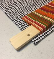 Use a slat to hang your quilt. Ellen Lindner, AdventureQuilter.com/blog