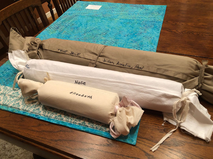 Quilts rolled and ready for shipping. Ellen Lindner, AdventureQuilter.com/blog