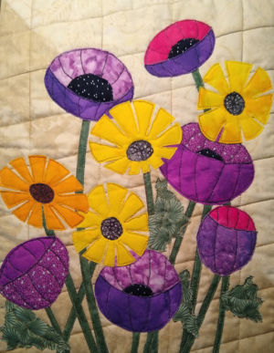 Nancy's quilt made in a Floral Improv class with Ellen Lindner. AdventureQuilter.com