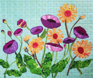 Student results from Ellen Lindner's "Floral Improv" class. AdventureQuilter.com