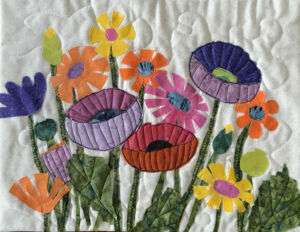 Colorful poppies and daisies. AdventureQuilter.com/blog